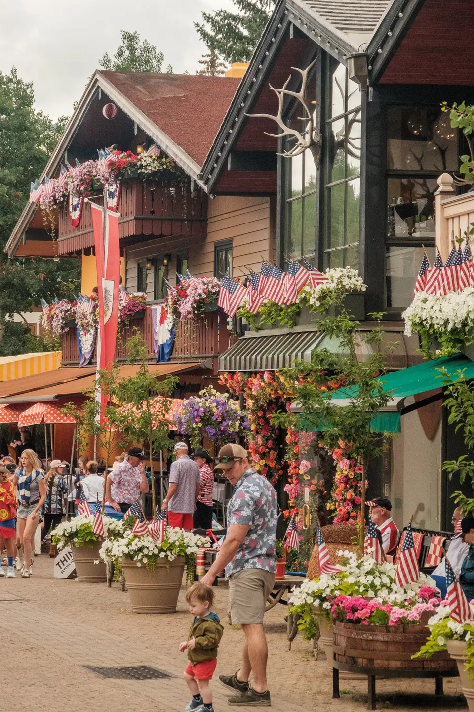 Vail Village street hung with flags and flower baskets on the Fourth of July